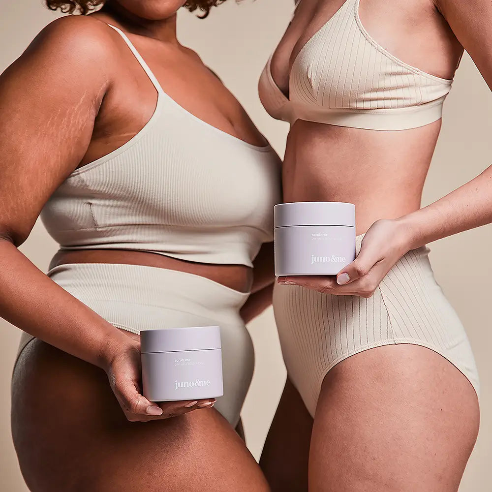 Women facing each other, holding the 2in1 AHA Body Scrub
