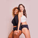 Zwei Frauen tragen schwarze Periodenunterwäsche Seamless-Daiy-and-Night mit sportlichem Oberteil.