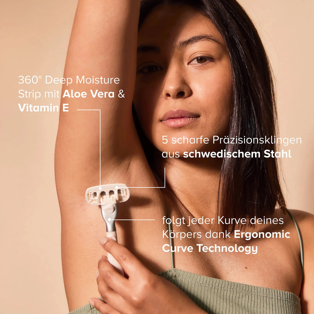 A woman shaves her underarm with the ergonomic razor.