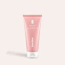 Intimate Pre-Shave Peeling in a pink tube with a white cap, from the Glow Below line by juno&me