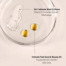Textures in the Glow Below Duo: clear Wash & Shave Gel and golden oil drops in a glass dish