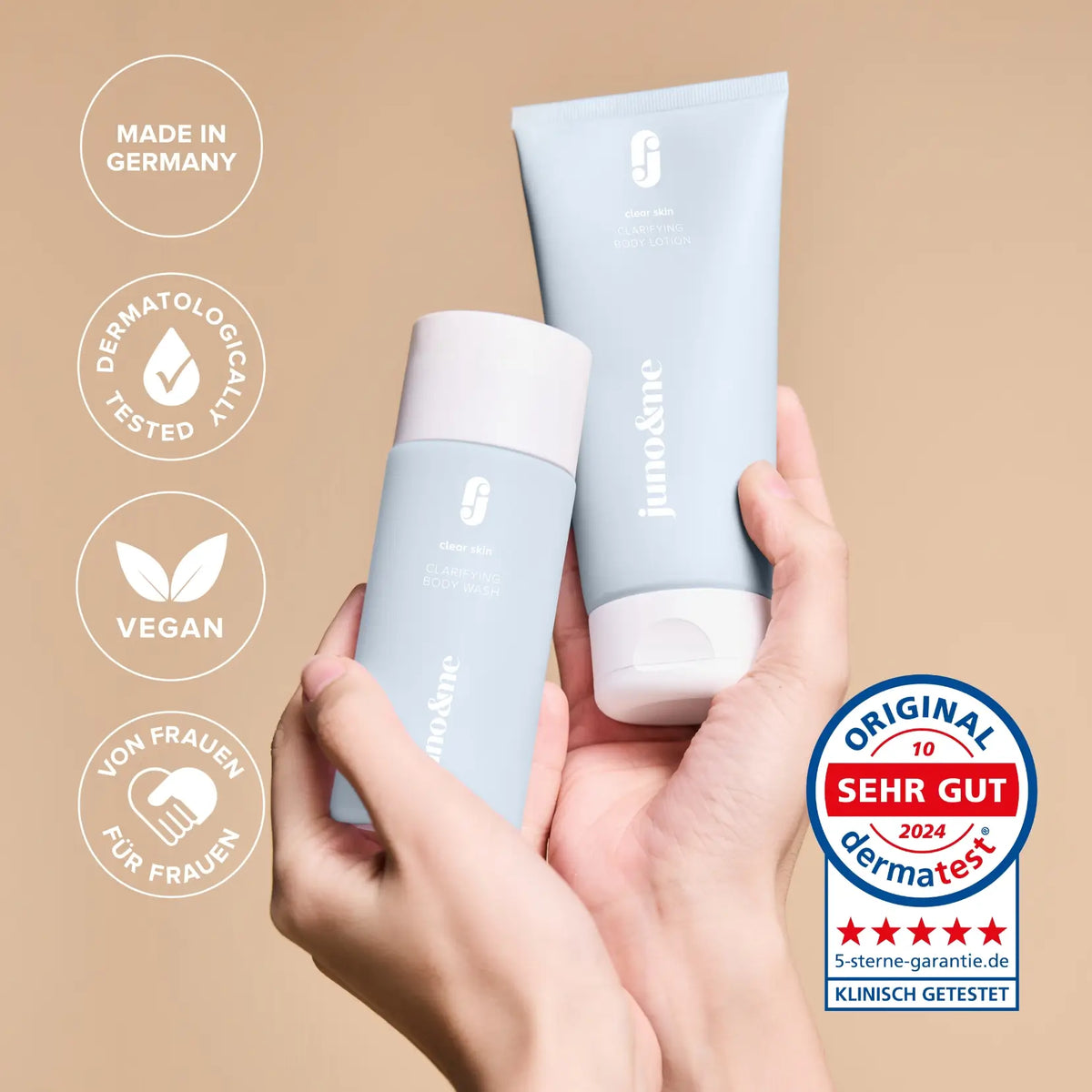 Hands holding the Clarifying Body Duo, with Made in Germany and vegan seals and the German Dermatest seal "sehr gut" 2024