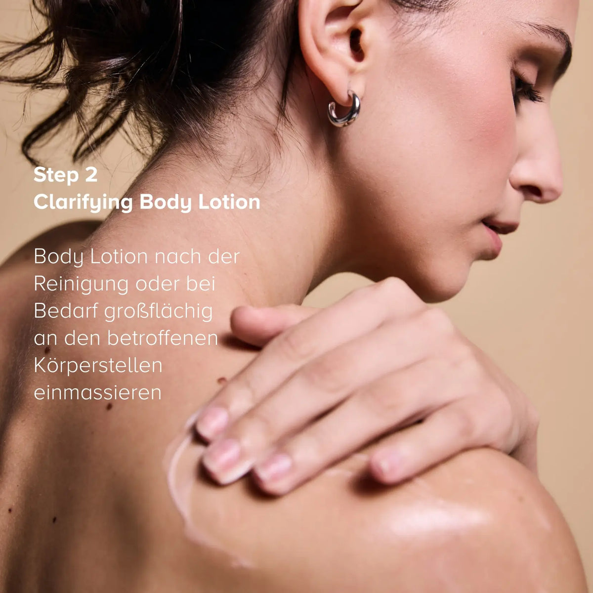Step 2 of the Clarifying Body Duo: woman massaging the Clarifying Body Lotion into her shoulder and back